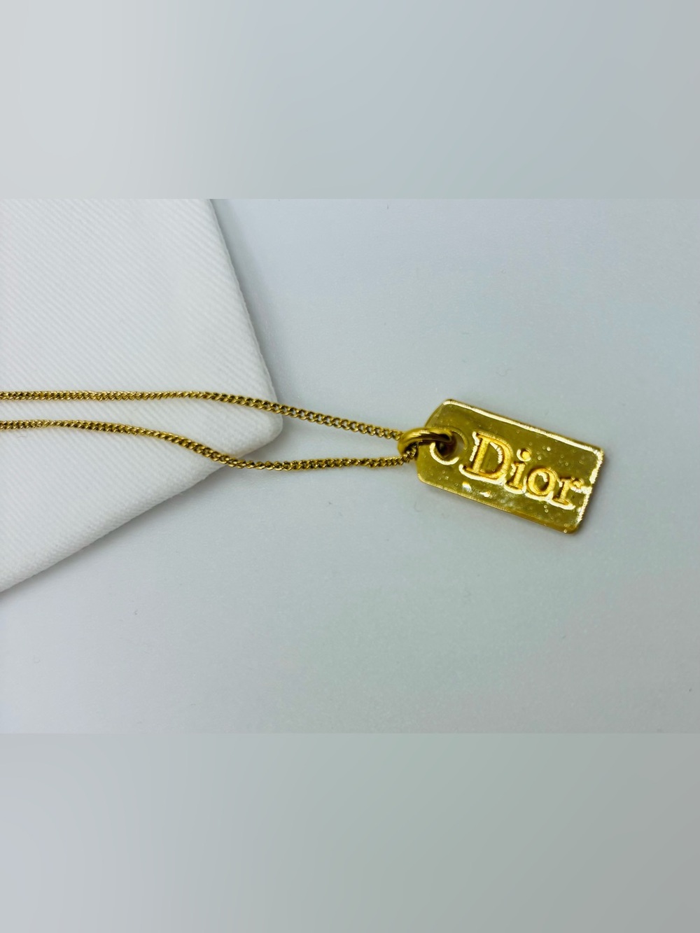 Dior golf tag pendant necklace with white dust bag